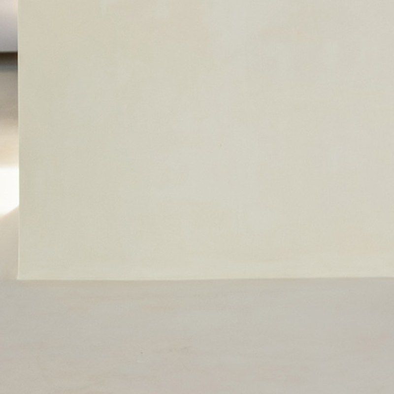 A smooth cream surface where the kitchen island meets the floor.